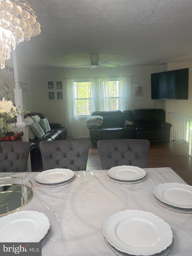 8807 Doug Dr, Nokesville, VA 20181 - dining room featuring a textured ceiling and wood finished floors