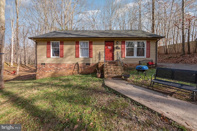 single story home with fence, roof with shingles, a front lawn, and crawl space