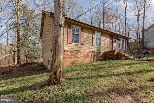 view of property exterior with a lawn