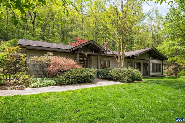 4547 Taylor Creek Rd, Afton, VA 22920 - view of front facade featuring a front yard, a forest view, and a chimney