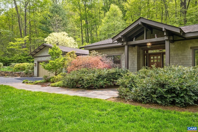 4547 Taylor Creek Rd, Afton, VA 22920 - view of front facade featuring roof with shingles, an attached garage, a view of trees, and a front lawn