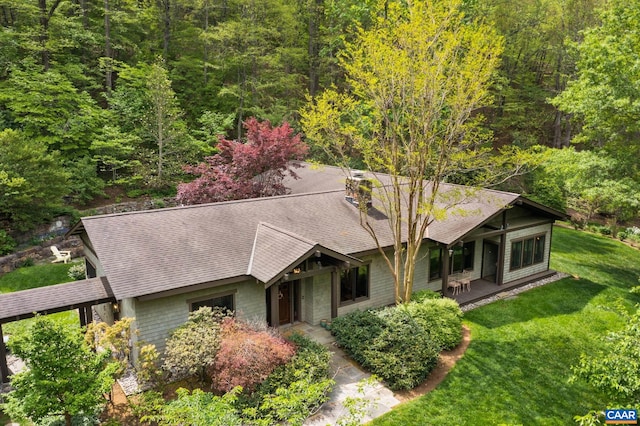 4547 Taylor Creek Rd, Afton, VA 22920 - view of front of house with a front lawn, a chimney, a shingled roof, and a wooded view