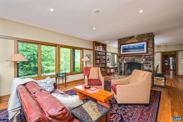 4547 Taylor Creek Rd, Afton, VA 22920 - living room featuring recessed lighting, a stone fireplace, and wood finished floors