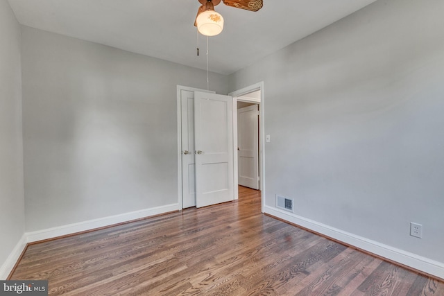 7540 Park Ln, Annandale, VA 22003 - spare room featuring wood finished floors, baseboards, and ceiling fan