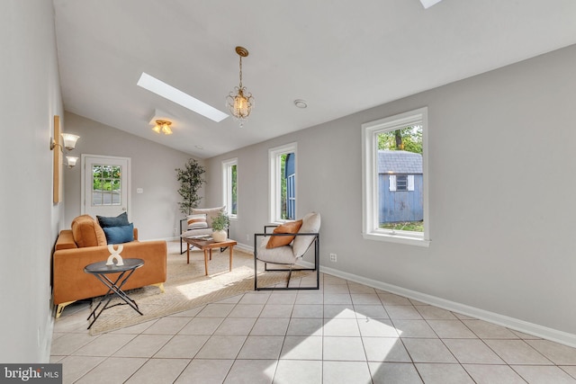 7540 Park Ln, Annandale, VA 22003 - living area with plenty of natural light, a skylight, lofted ceiling, light tile patterned floors, and baseboards