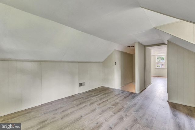 7540 Park Ln, Annandale, VA 22003 - additional living space featuring wood finished floors and vaulted ceiling