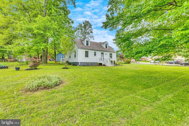 7540 Park Ln, Annandale, VA 22003 - view of grassy yard with a storage shed and an outdoor structure