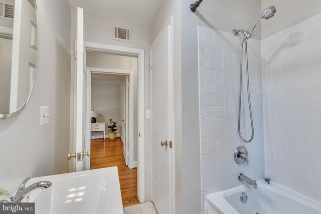 7540 Park Ln, Annandale, VA 22003 - full bath featuring shower / washtub combination and wood finished floors