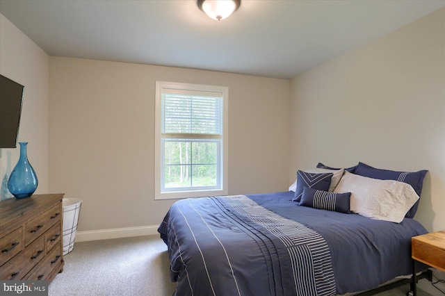 carpeted bedroom with baseboards