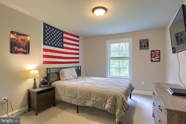 carpeted bedroom with baseboards