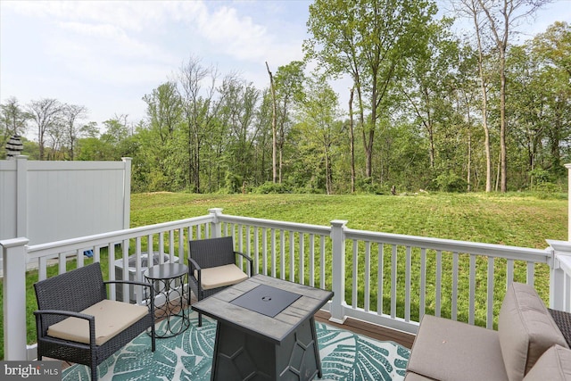 deck featuring a yard and cooling unit