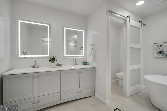 2407 Mare Ln, Oakton, VA 22124 - full bathroom with a soaking tub, toilet, double vanity, tile patterned flooring, and baseboards