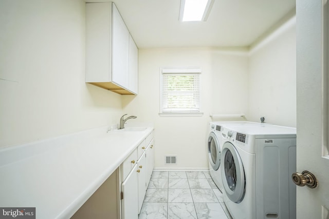 2407 Mare Ln, Oakton, VA 22124 - laundry area featuring light marble finish floors, independent washer and dryer, cabinet space, and baseboards