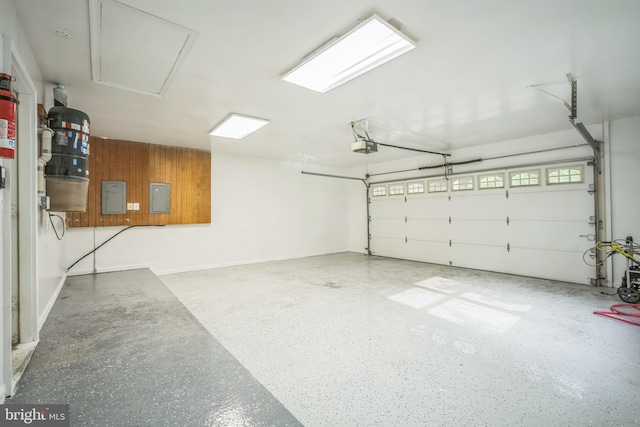 2407 Mare Ln, Oakton, VA 22124 - garage featuring electric panel, a garage door opener, wooden walls, and baseboards