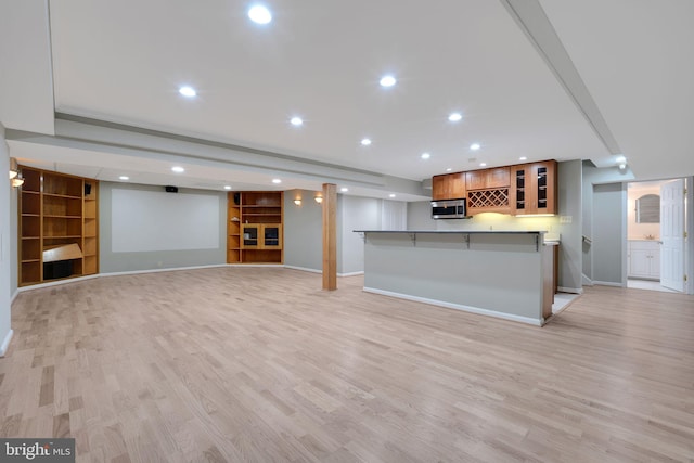 2407 Mare Ln, Oakton, VA 22124 - kitchen featuring stainless steel microwave, baseboards, light wood-style floors, recessed lighting, and built in features