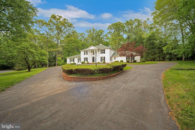 2407 Mare Ln, Oakton, VA 22124 - greek revival inspired property featuring asphalt driveway and a front lawn