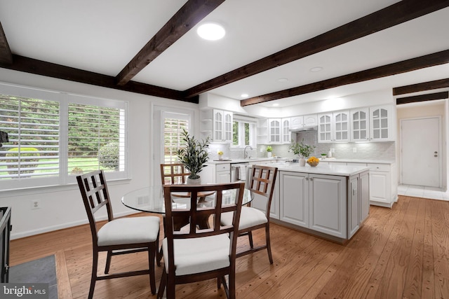 2407 Mare Ln, Oakton, VA 22124 - dining space featuring beam ceiling, light wood finished floors, healthy amount of natural light, and baseboards