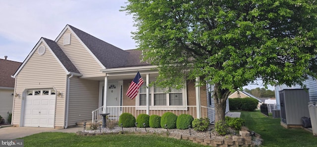 view of front of property with a front lawn, an attached garage, a shingled roof, a porch, and driveway
