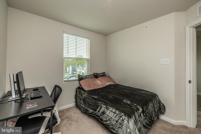 bedroom with baseboards, carpet, and visible vents