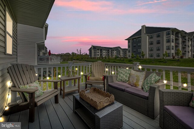 wooden terrace with outdoor lounge area