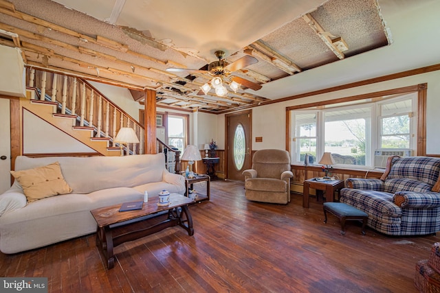 living area featuring stairway, a wealth of natural light, hardwood / wood-style flooring, and a ceiling fan