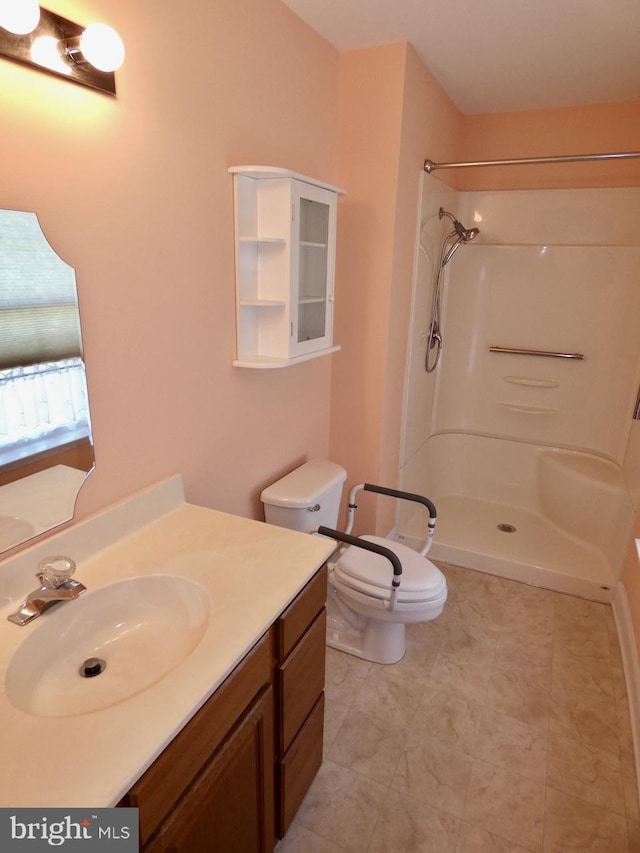 full bath featuring vanity, tile patterned flooring, a shower, and toilet
