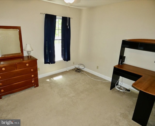 bedroom with baseboards and carpet