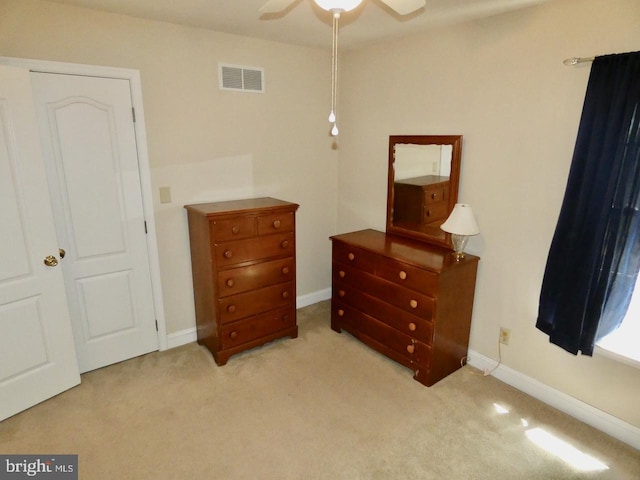 bedroom featuring baseboards, visible vents, and carpet
