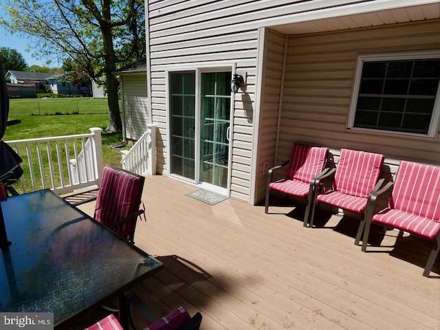 deck featuring a yard
