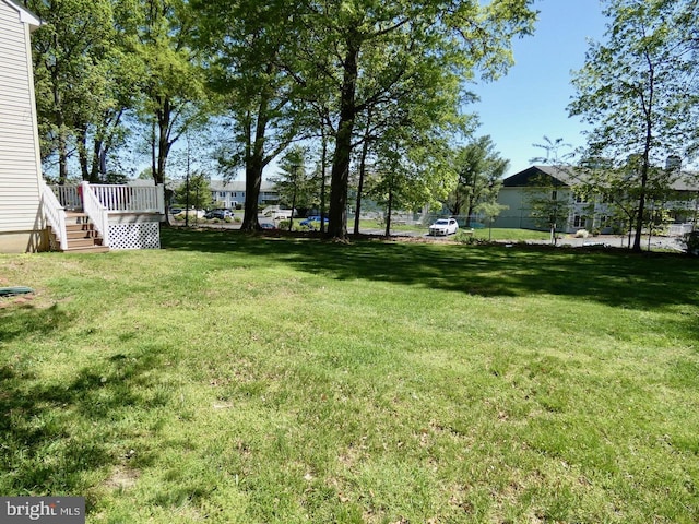 view of yard with a deck