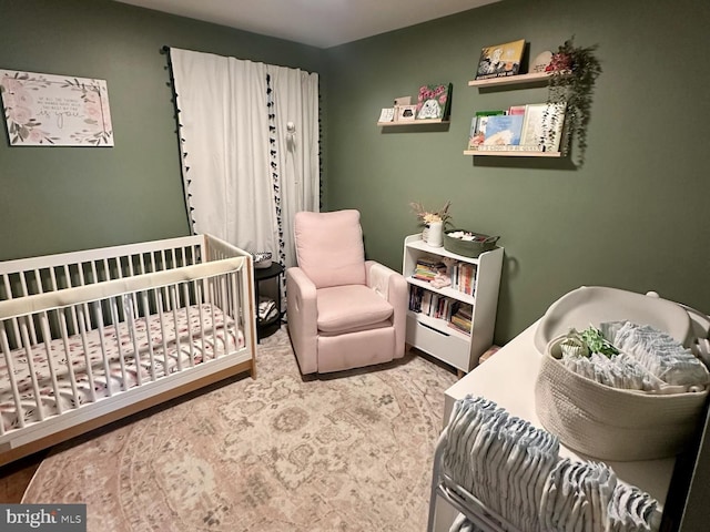 bedroom with a nursery area