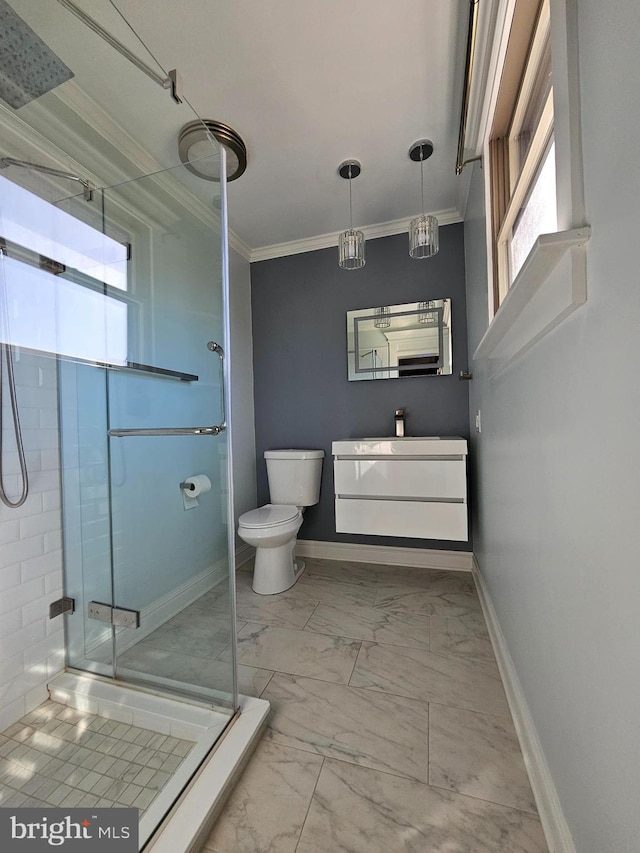full bath featuring crown molding, marble finish floor, baseboards, and a shower stall