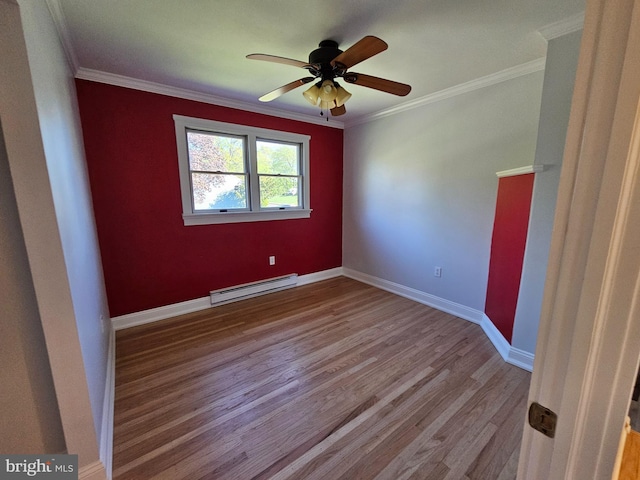 unfurnished room featuring a ceiling fan, ornamental molding, baseboard heating, and wood finished floors