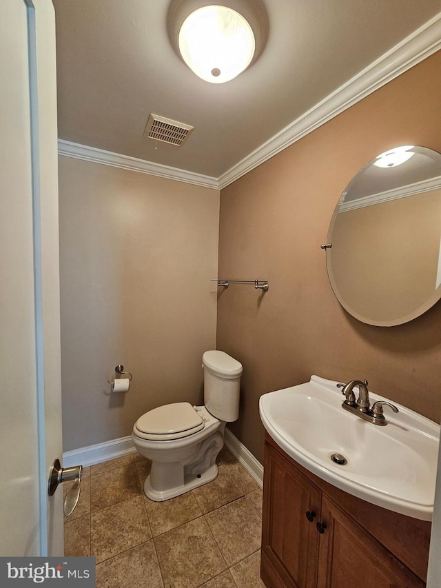 bathroom with visible vents, baseboards, vanity, toilet, and ornamental molding