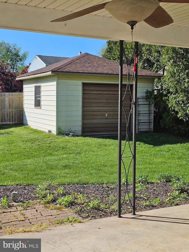 view of outbuilding with fence and an outdoor structure