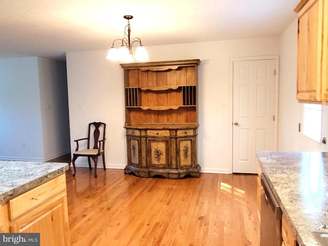 1048 Mill Rd, Woodstock, VA 22664 - dining area featuring light wood-type flooring, baseboards, and a notable chandelier