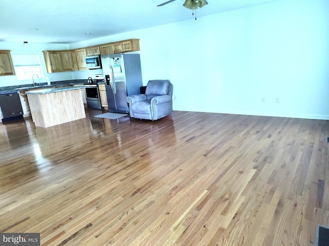 1048 Mill Rd, Woodstock, VA 22664 - living area with a ceiling fan and wood finished floors