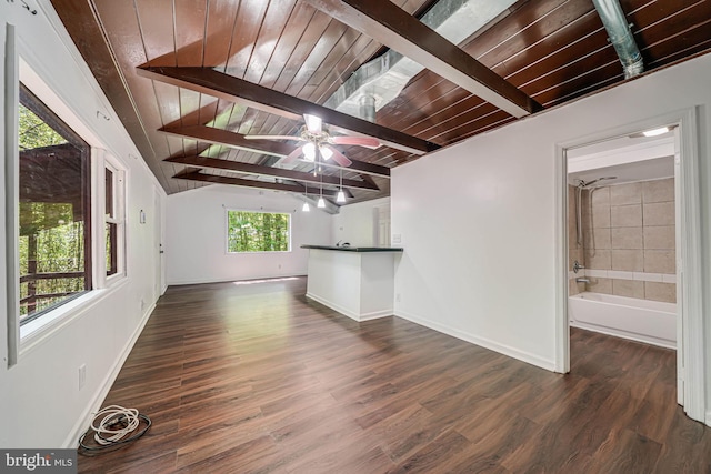 unfurnished living room with baseboards, wooden ceiling, and vaulted ceiling with beams