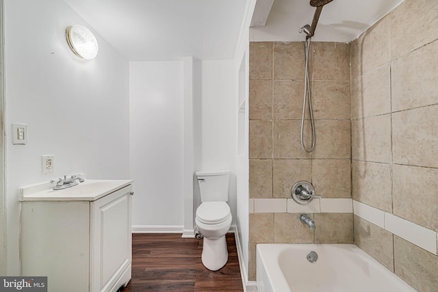 full bathroom featuring vanity, wood finished floors, bathing tub / shower combination, and toilet