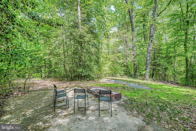 view of patio featuring a view of trees