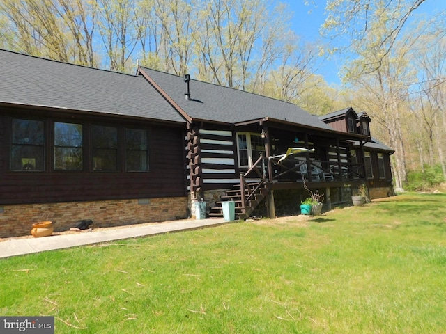 21165 State Road 55, Wardensville, WV 26851 - rear view of house with a lawn, log siding, and a shingled roof