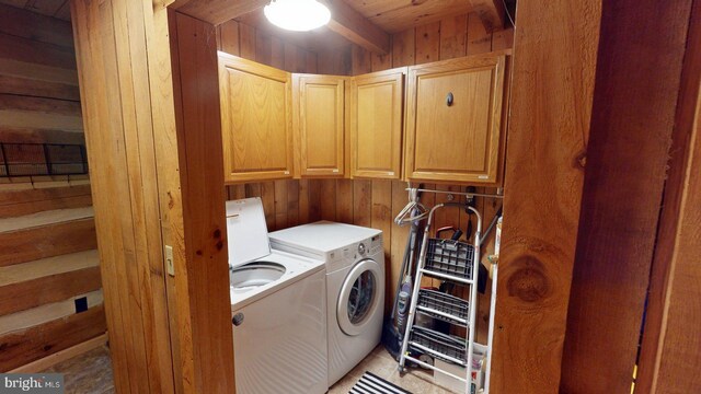 21165 State Road 55, Wardensville, WV 26851 - laundry area featuring cabinet space, washer and dryer, and wooden walls