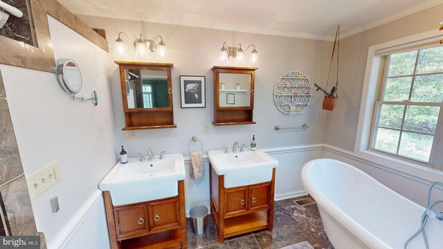 21165 State Road 55, Wardensville, WV 26851 - bathroom featuring marble tiled floors, a wainscoted wall, ornamental molding, a freestanding bath, and two vanities