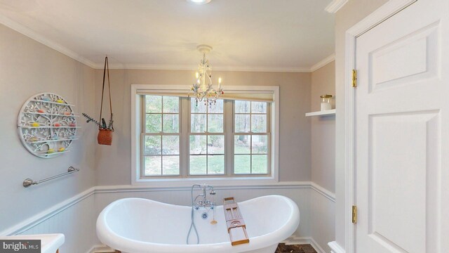 21165 State Road 55, Wardensville, WV 26851 - bathroom featuring wainscoting, a chandelier, a decorative wall, a soaking tub, and ornamental molding
