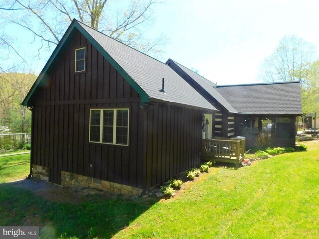 21165 State Road 55, Wardensville, WV 26851 - view of side of home with roof with shingles, a yard, board and batten siding, and a deck