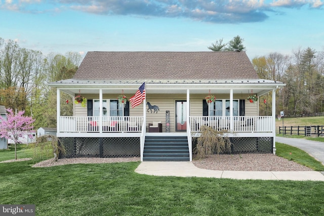 18 Boyds Hollow Rd, Biglerville, PA 17307 - bungalow-style house featuring a porch, a front lawn, and roof with shingles