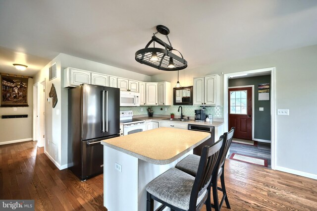 18 Boyds Hollow Rd, Biglerville, PA 17307 - kitchen featuring white appliances, a sink, light countertops, dark wood-type flooring, and baseboards