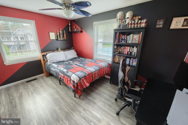 18 Boyds Hollow Rd, Biglerville, PA 17307 - bedroom featuring multiple windows, wood finished floors, a ceiling fan, and baseboards