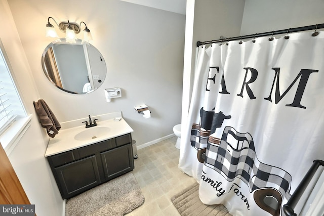 18 Boyds Hollow Rd, Biglerville, PA 17307 - bathroom featuring toilet, vanity, baseboards, and a shower with curtain