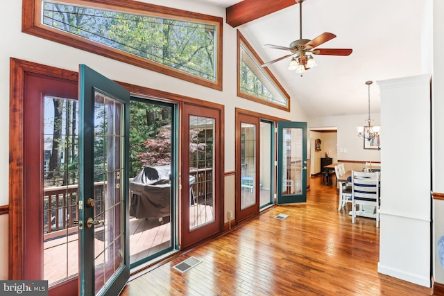 entryway with high vaulted ceiling, plenty of natural light, beamed ceiling, and french doors